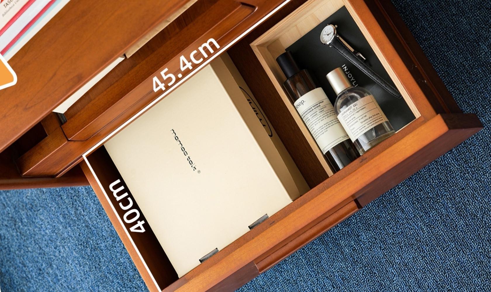 Wooden drawer with skincare products and a notebook, labeled '45.4cm'.