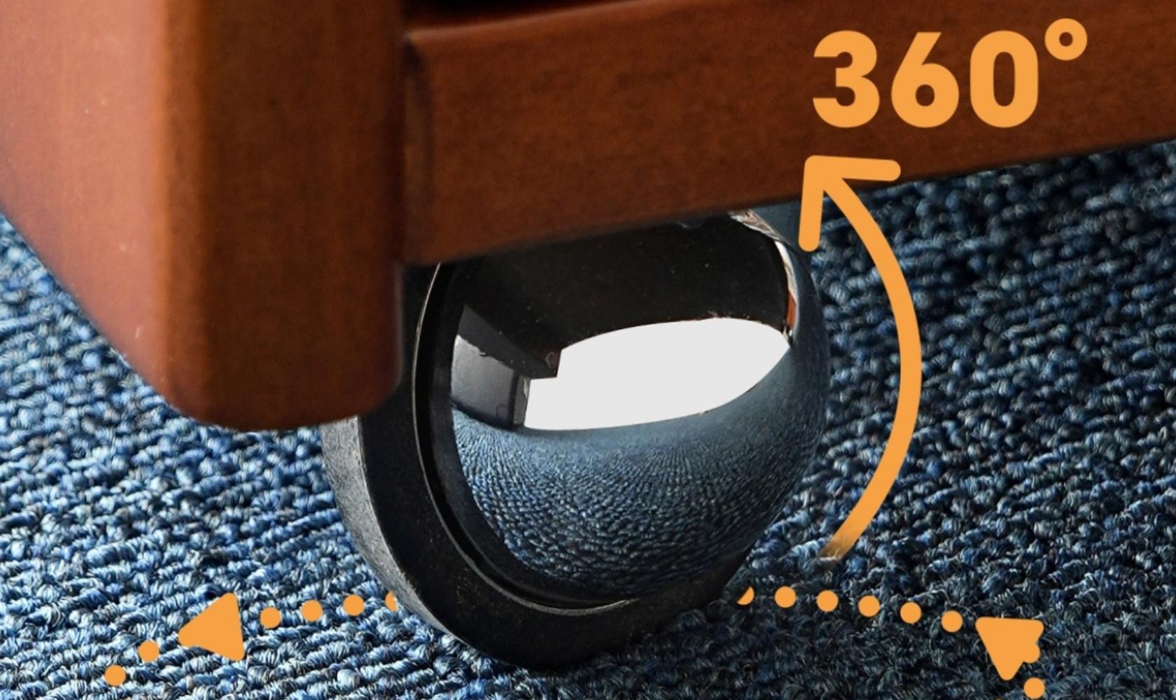 Close-up of a suitcase wheel with '360°' text on a textured surface