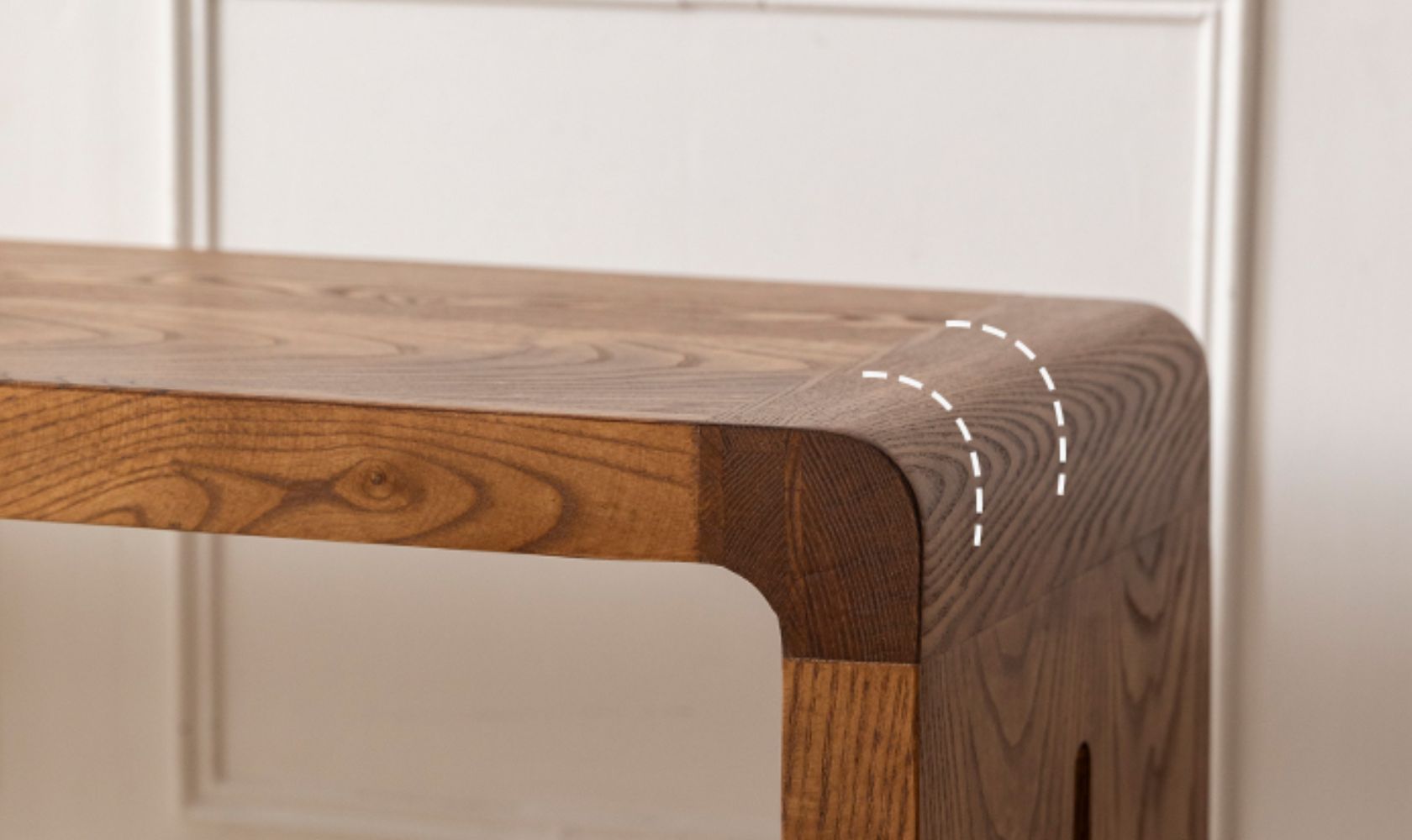 Wooden bench with a focus on the corner joint and finish.