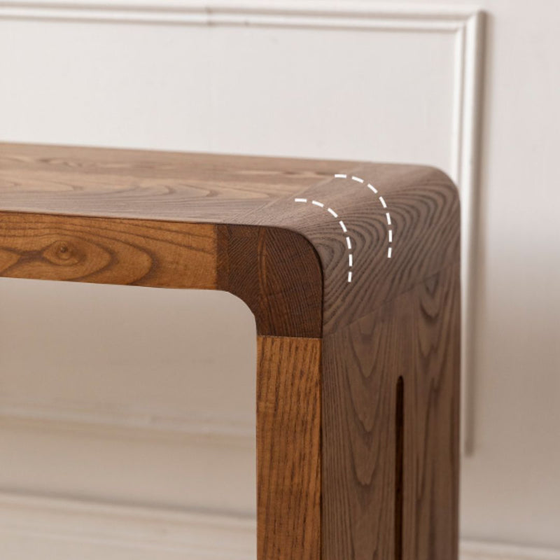Wooden furniture corner with a white wall background