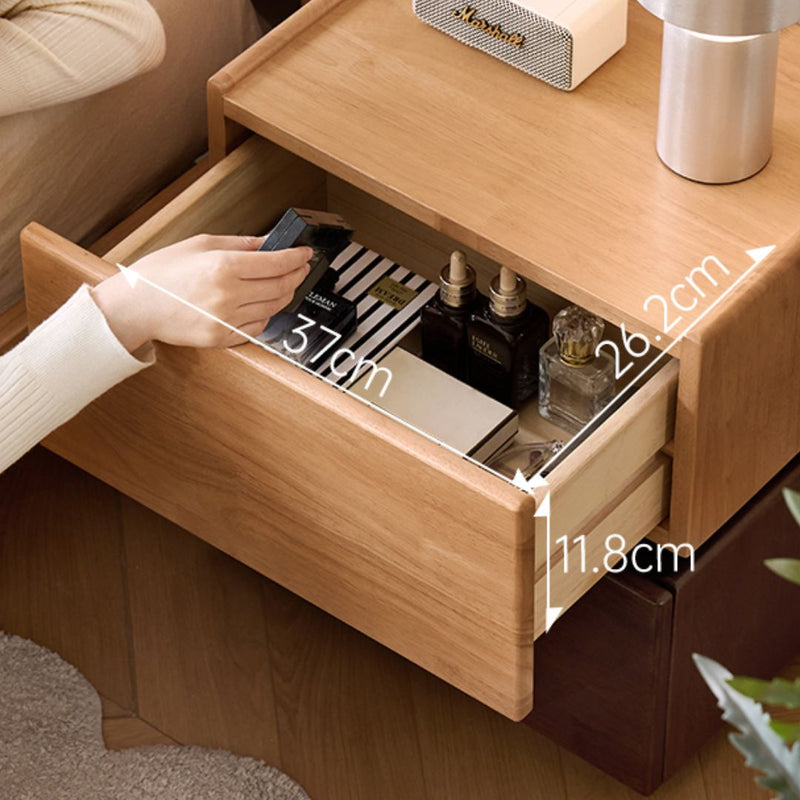 Wooden drawer with dimensions labeled, showing a hand reaching inside.