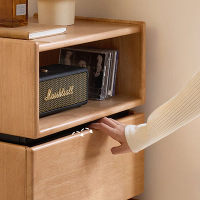 Person opening a wooden cabinet with a Marshall speaker inside