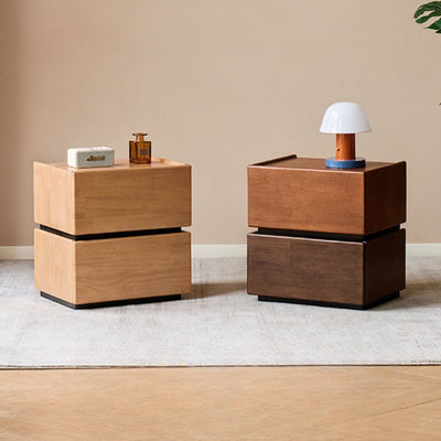 Two wooden nightstands with decorative items on a neutral background