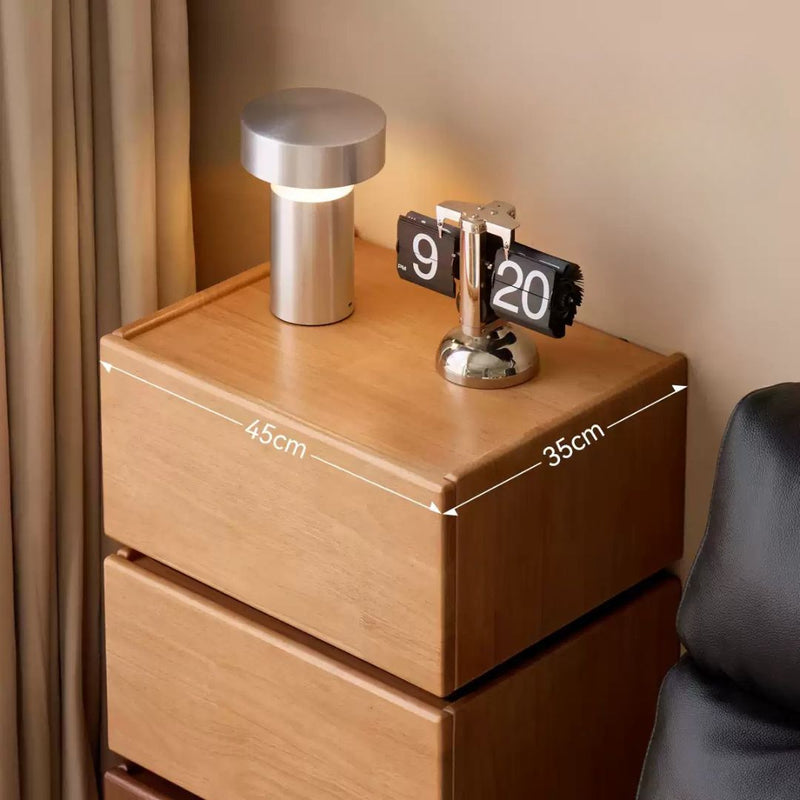 Wooden nightstand with a lamp and digital clock, dimensions indicated.
