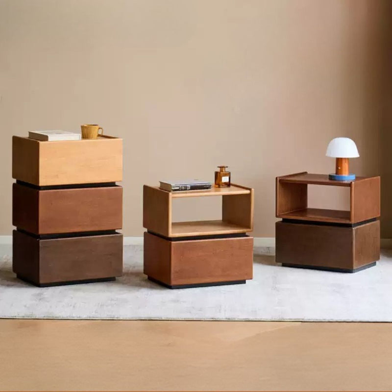 Set of wooden side tables with various items on a neutral background