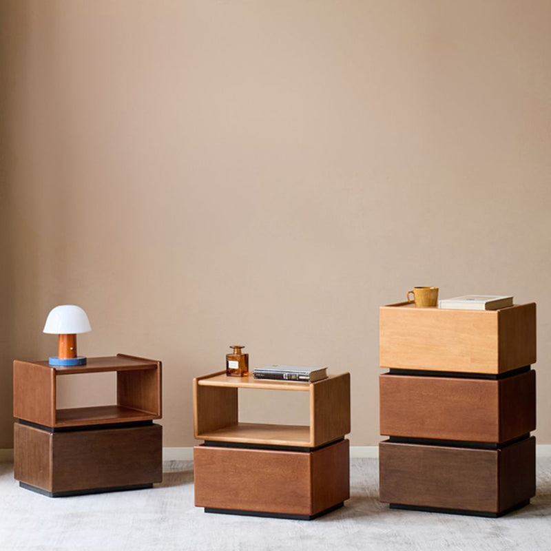 Set of wooden side tables against a beige wall
