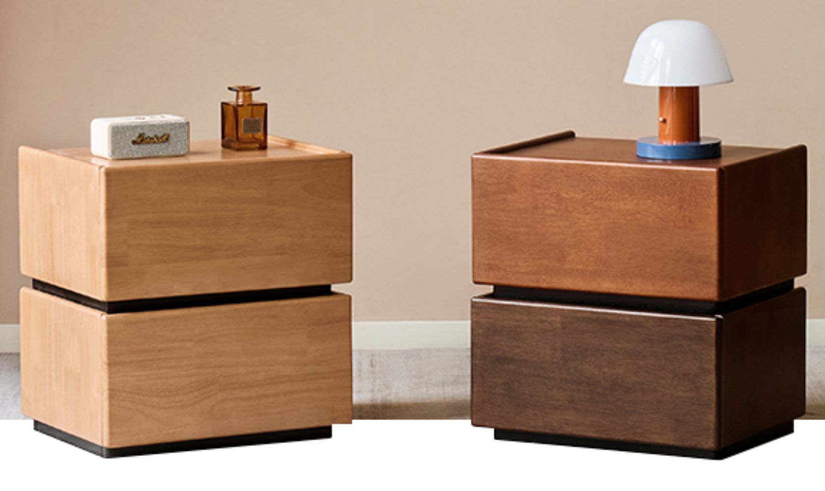 Two wooden nightstands with decorative items against a beige wall.